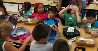 students eating lunch in cafeteria